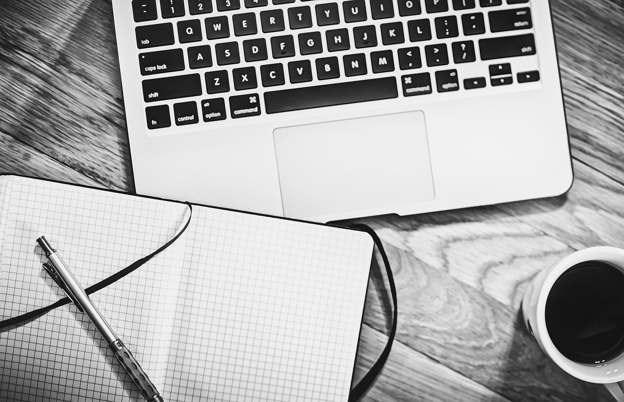 Computer, notebook, coffee — Virginia Background Check Laws and Regulations